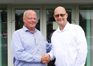 August Lundh joins forces with Roltex, owners Peter Wall and Karl Huylebroeck shake hands
